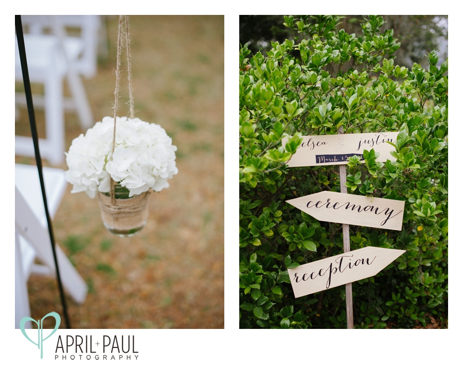 Rustic wooden wedding sign and flowers in jars
