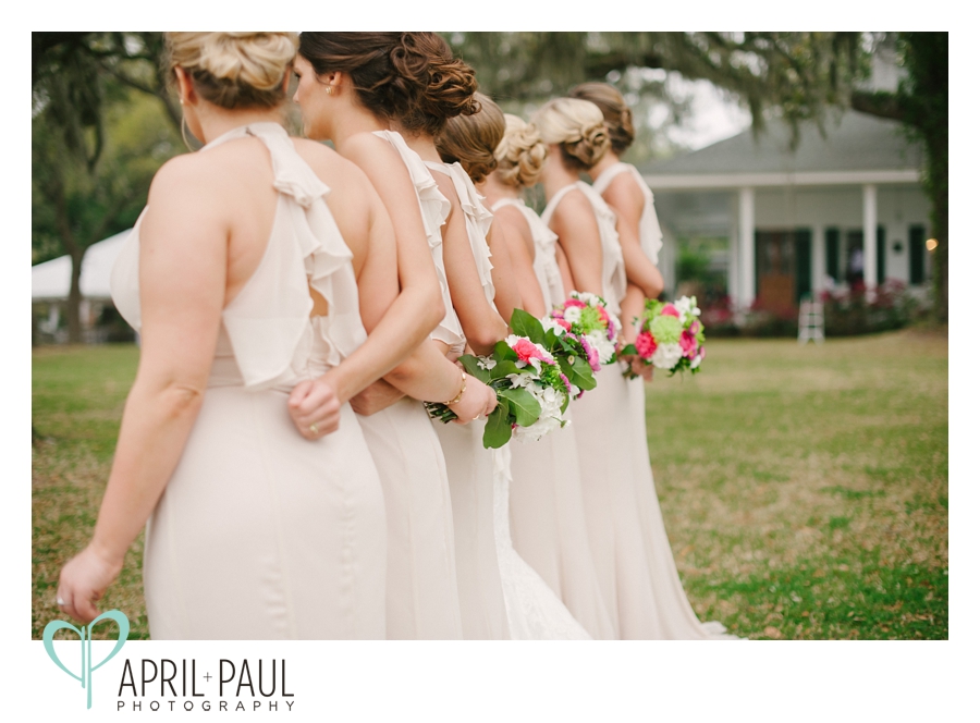 Bridesmaids holding bouquets at The Old Place in Gautier, MS