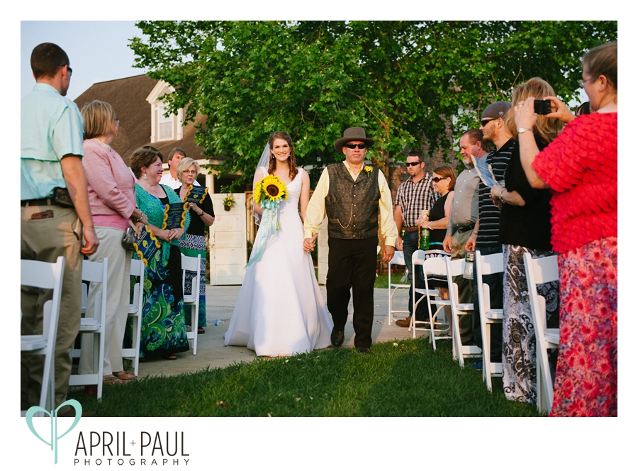 Father walking bride down the aisle at small backyard wedding in Mississippi