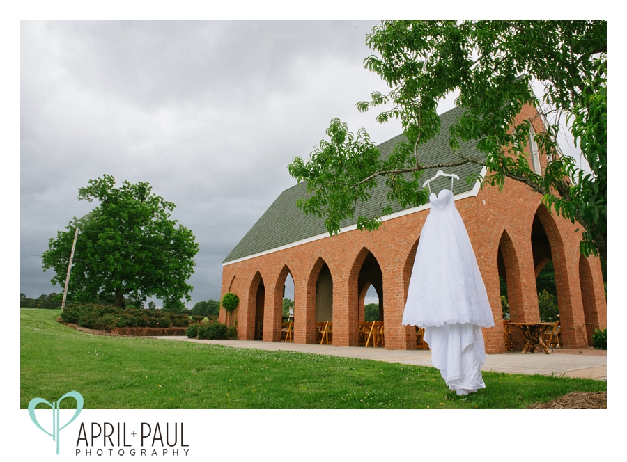 Dress hanging from tree at Oak Hill Stables Wedding Venue in Oxford, MS