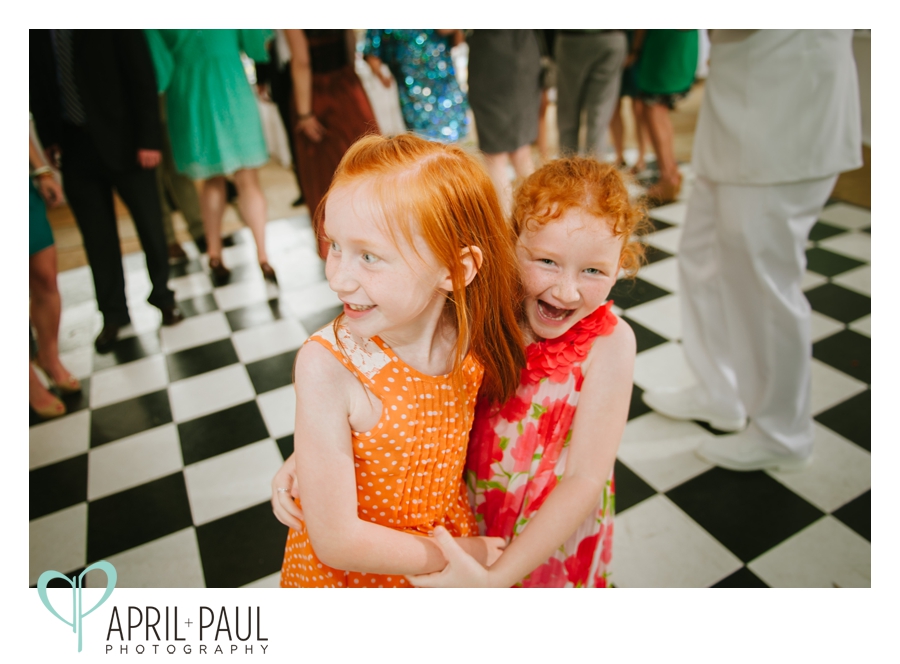 two little red headed girls dancing at reception in mississippi