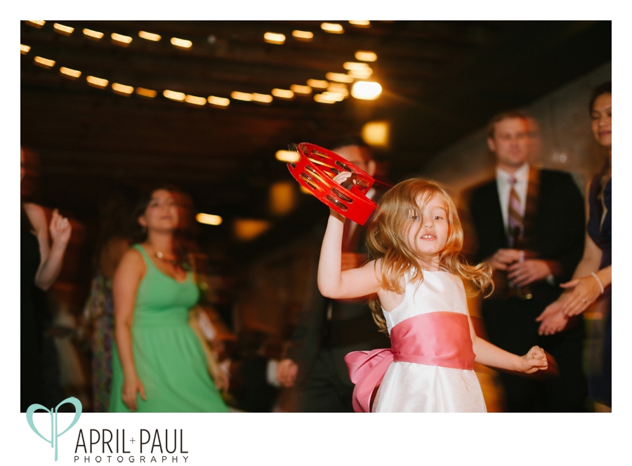 Little girl dancing with MOjeaux bands tambourine at The Chicory wedding in New Orleans